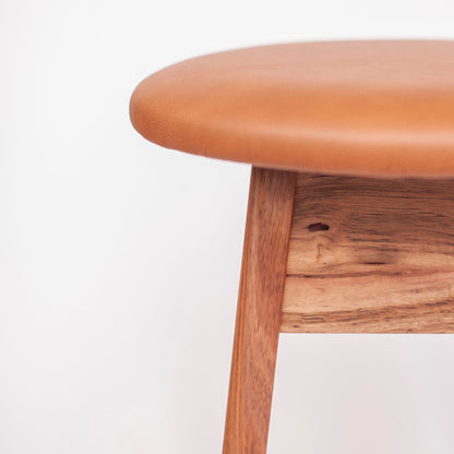 Olive Stool | Solid Wormy Chestnut, Brass Footrail, Tan Leather Seat (In Stock)